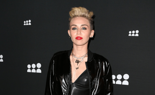 Miley Cyrus' Latest Look: Leather Bustier and Half-Jeans, Half-Sweatpants