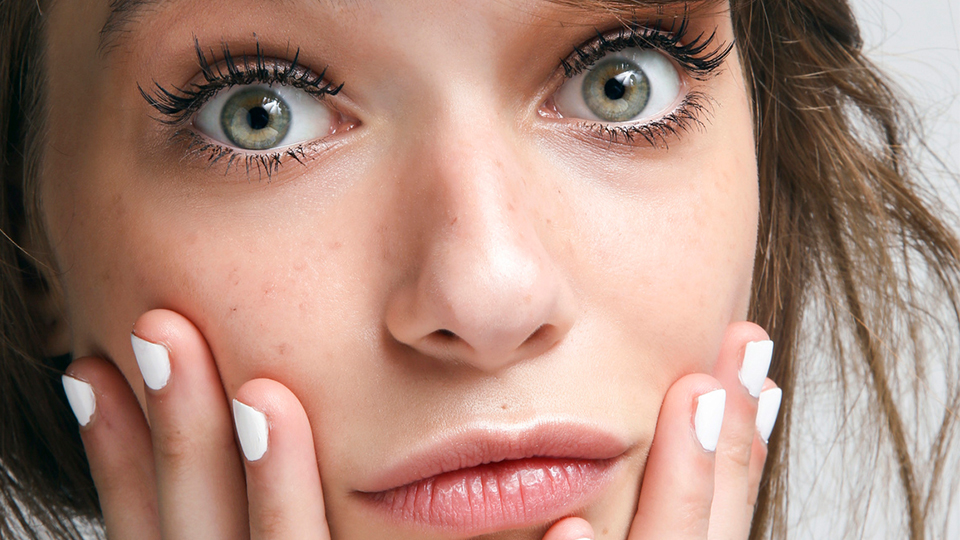 girl white nail polish surprised