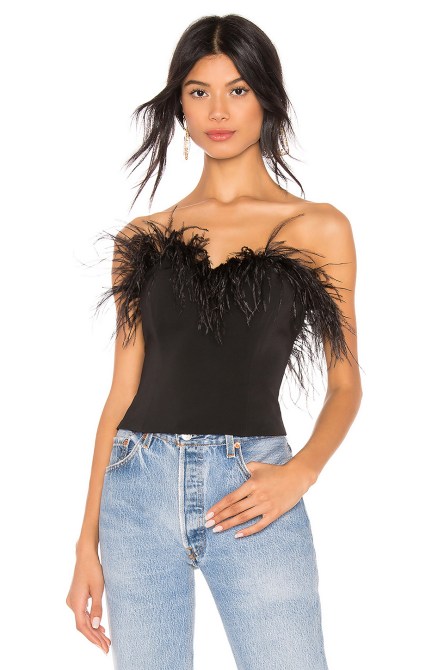 STYLECASTER | Feather Embellishments Are Replacing Last Year’s Sequin Trend For Holiday Parties
