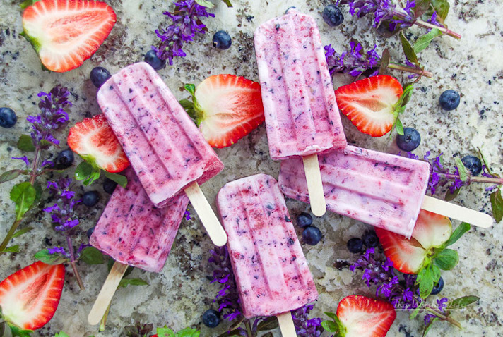 STYLECASTER | 17 DIY Popsicles To Make With All That Summer Fruit | Strawberry-Blueberry Yogurt Popsicles