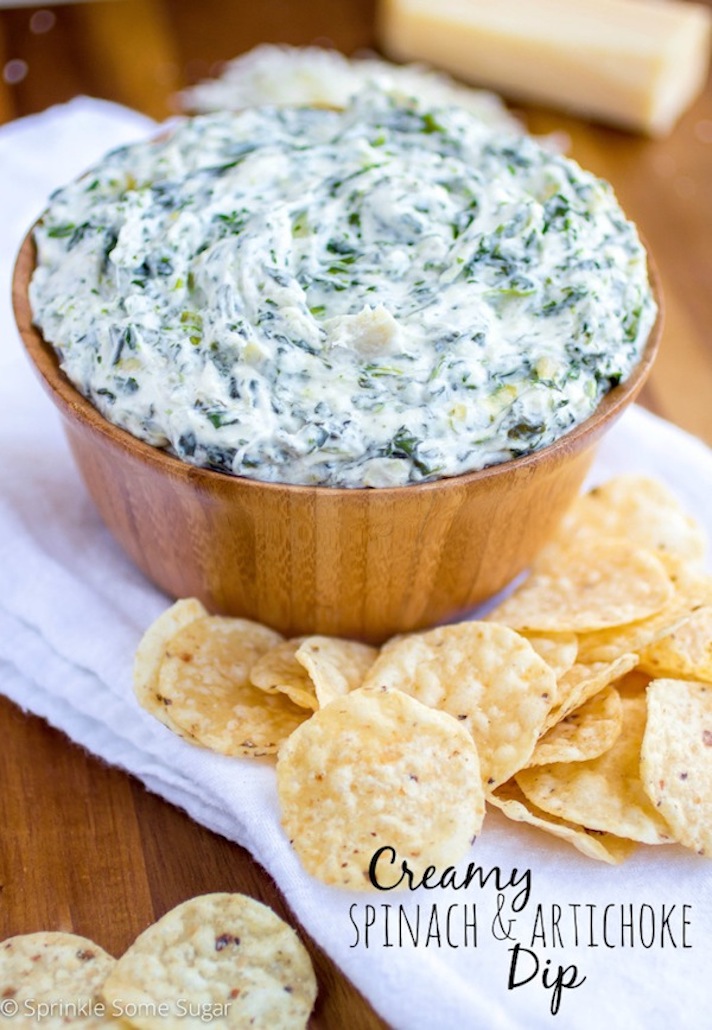 STYLECASTER | 17 Halloween Dips You Can Serve In A Pumpkin | Creamy Spinach Artichoke Dip