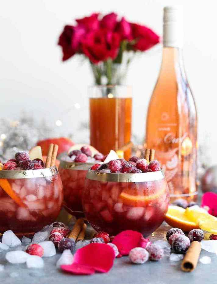 STYLECASTER | 15 Big-Batch Holiday Cocktails You Can Make With Boxed Wine | Winter Rose Sangria