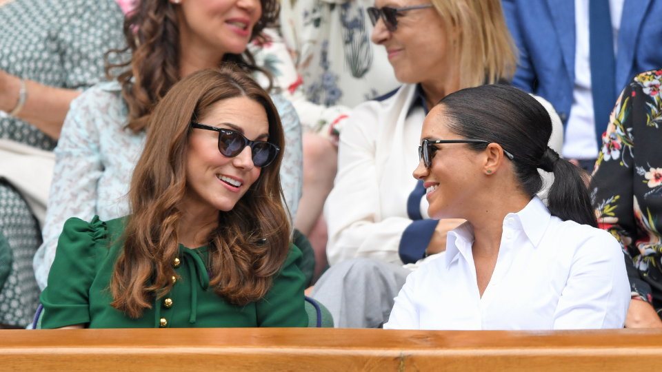 Kate Middleton (Princess of Wales) sitting next to Meghan Markle (Duchess of Sussex)