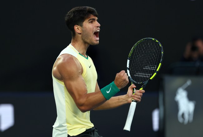 MELBOURNE, AUSTRALIA - JANUARY 22: Carlos Alcaraz of Spain celebrates a point during their fourth round singles match against Miomir Kecmanovic of Serbia during the 2024 Australian Open at Melbourne Park on January 22, 2024 in Melbourne, Australia.