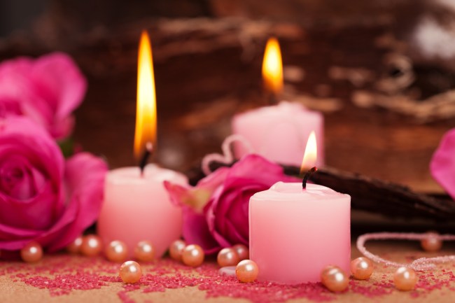 Pink Candles surrounded by pink pearls, ready for a ritual