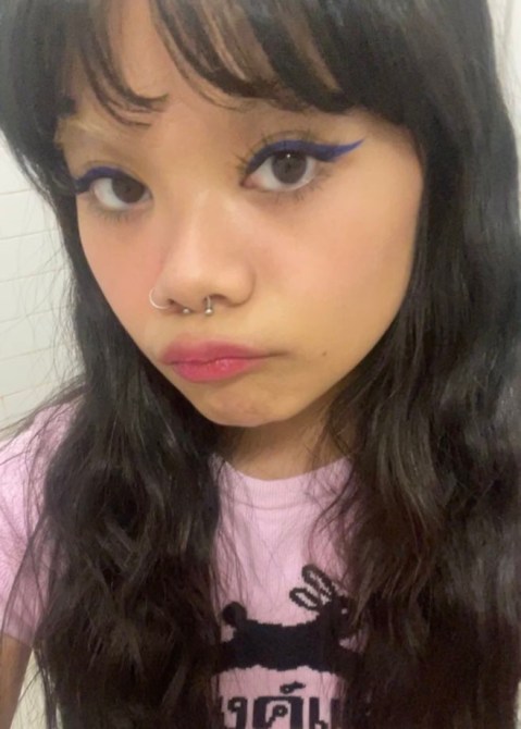 Beauty writer wearing blue Matte Fluid Eye Paint as eyeliner, as well as the about-face foundation and blush.