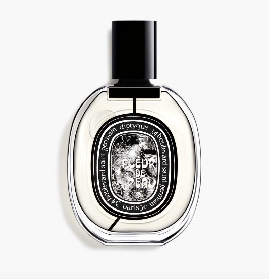 Fleur de Peau by Diptyque in a round clear bottle with a black cap, the bottle has the signature black Diptyque label at the center.