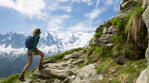 Woman climbing a mountain
