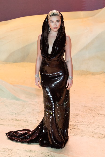 Florence Pugh in a chocolate brown sequin gown with a cowl neck and attached hood at the London "Dune: Part Two" premiere