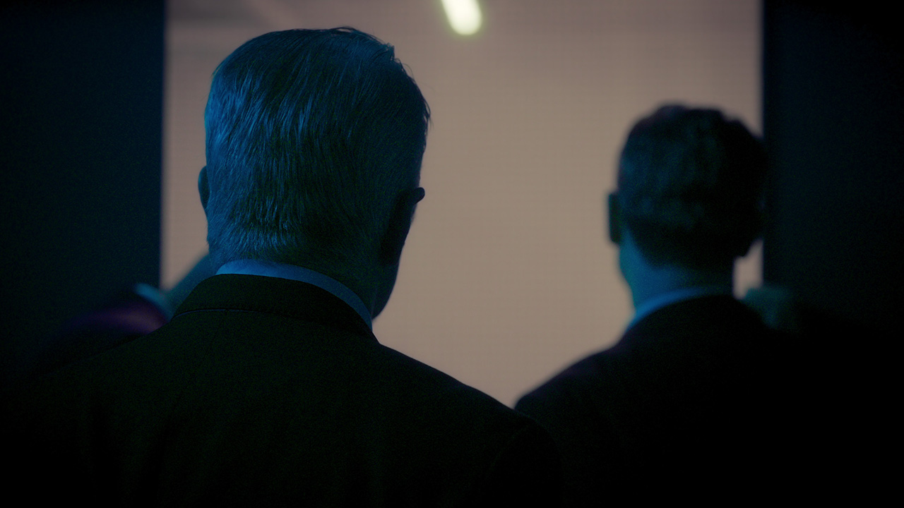 Back of two men's heads.