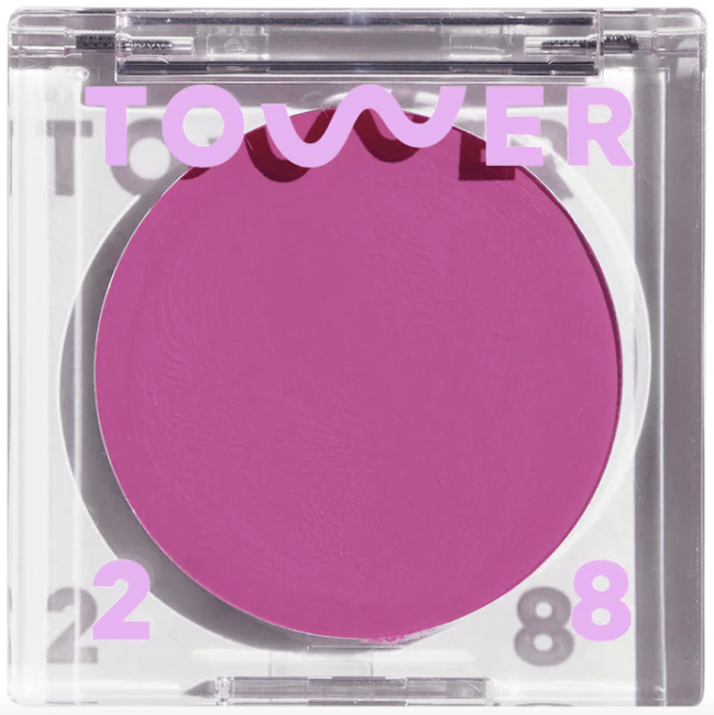 Tower 28 BeachPlease Lip + Cheek Cream Blush in Party Hour a bright purple shade.