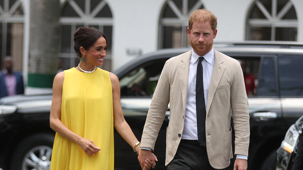 Duchess of Sussex, and Britain's Prince Harry (R), Duke of Sussex arrive at the State Governor House in Lagos on May 12, 2024 as they visit Nigeria as part of celebrations of Invictus Games anniversary.