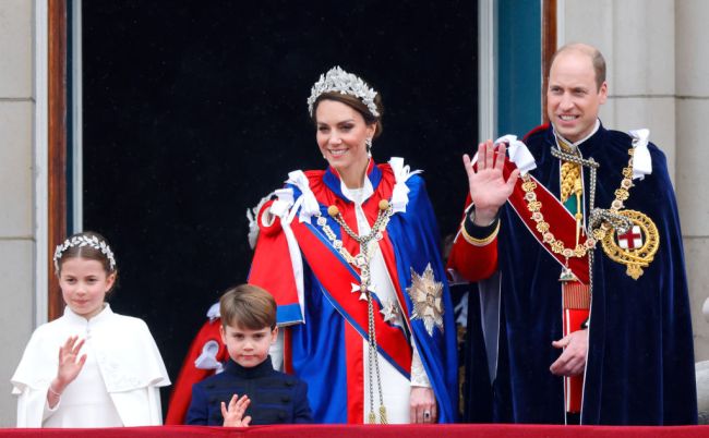 Princess Charlotte of Wales, Prince Louis of Wales, Catherine, Princess of Wales (wearing the Mantle of the Royal Victorian Order) and Prince William, Prince of Wales (wearing the Mantle of the Order of the Garter) watch an RAF flypast from the balcony of Buckingham Palace following the Coronation of King Charles III & Queen Camilla at Westminster Abbey on May 6, 2023 in London, England. The Coronation of Charles III and his wife, Camilla, as King and Queen of the United Kingdom of Great Britain and Northern Ireland, and the other Commonwealth realms takes place at Westminster Abbey today. Charles acceded to the throne on 8 September 2022, upon the death of his mother, Elizabeth II.