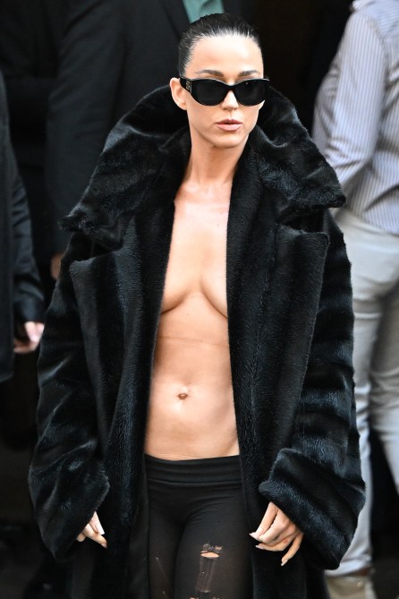Katy Perry wearing nothing under a black fur coat.