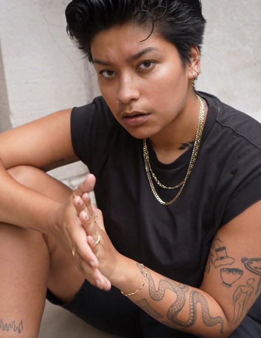 Model wears Automic Gold jewelry.