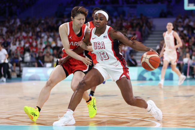 Jackie Young #13 of Team United States drives past Nanako Todo #75 of Team Japan during the Women's Group Phase - Group C game between Japan and United States on day three of the Olympic Games Paris 2024 at Stade Pierre Mauroy on July 29, 2024 in Lille, France.