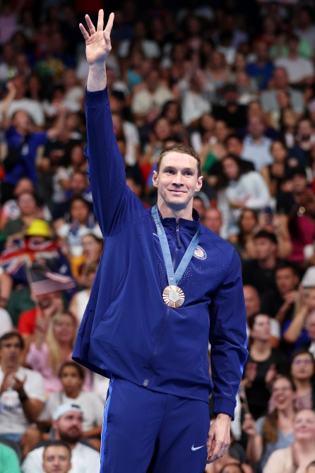 Bronze Medalist Ryan Murphy of Team United States stands on the podium during the Swimming medal ceremony after the Men’s 100m Backstroke Final on day three of the Olympic Games Paris 2024 at Paris La Defense Arena on July 29, 2024 in Nanterre, France.
