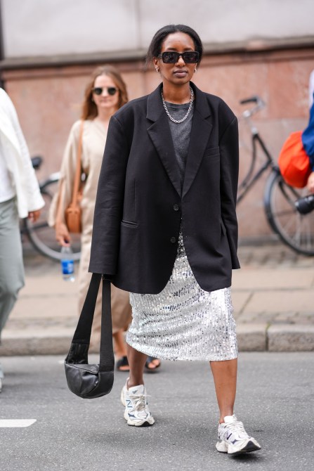 STYLECASTER | Minimalist Outift Ideas, Sneakers, sequin skirts, oversized blazer, pearl necklace, gray t-shirt