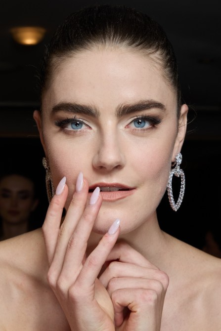 A model with milky nails.