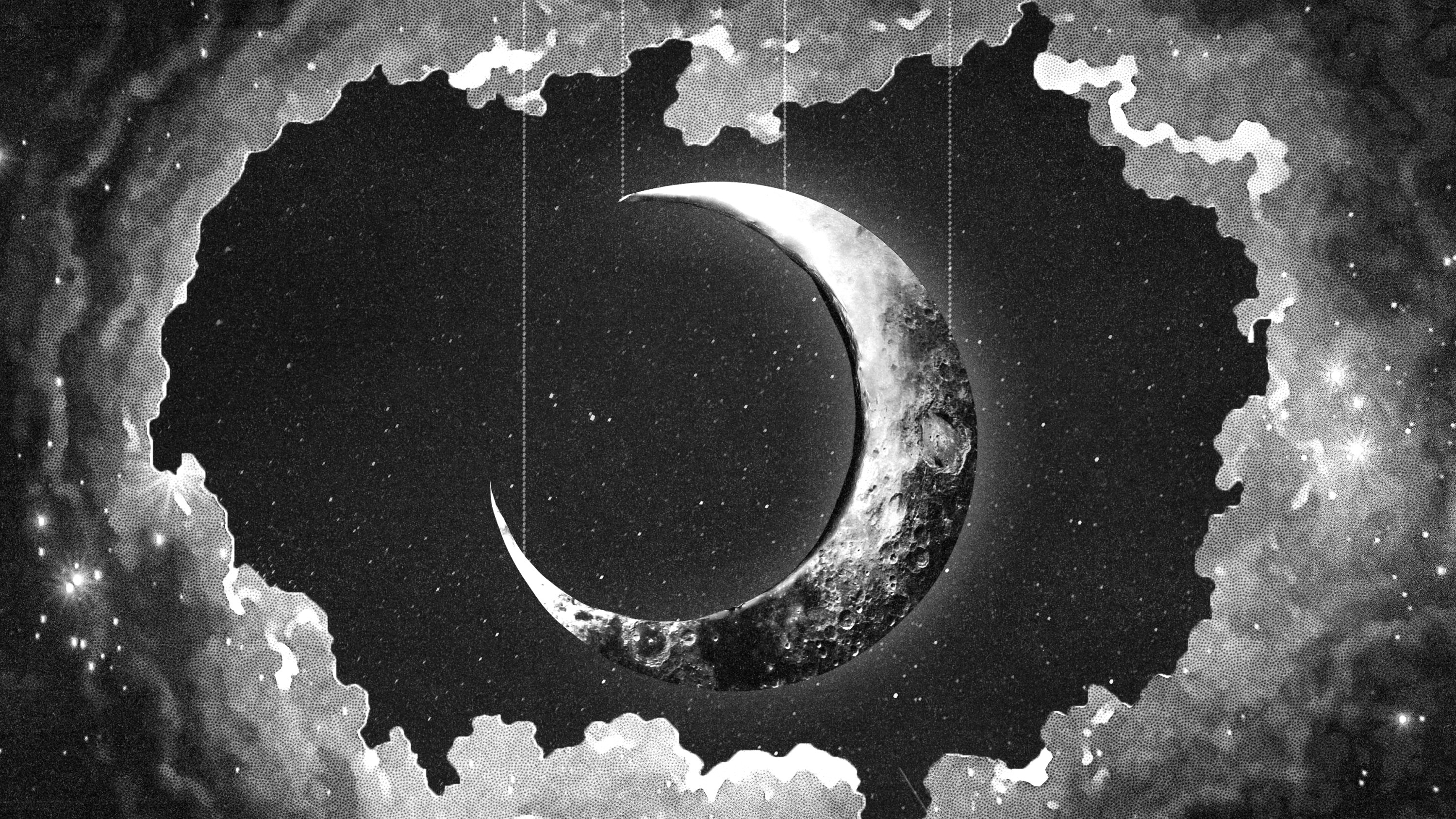 A crescent or new moon in black and white hanging from the sky