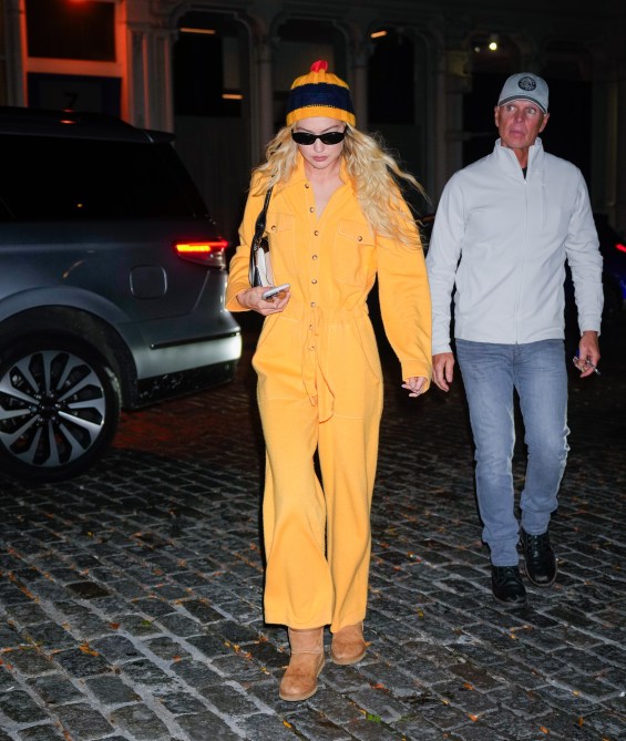 Gigi Hadid wearing a yellow outfit with Uggs.