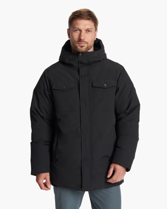 A model wearing the Vuori Northmost Insulated Parka in black