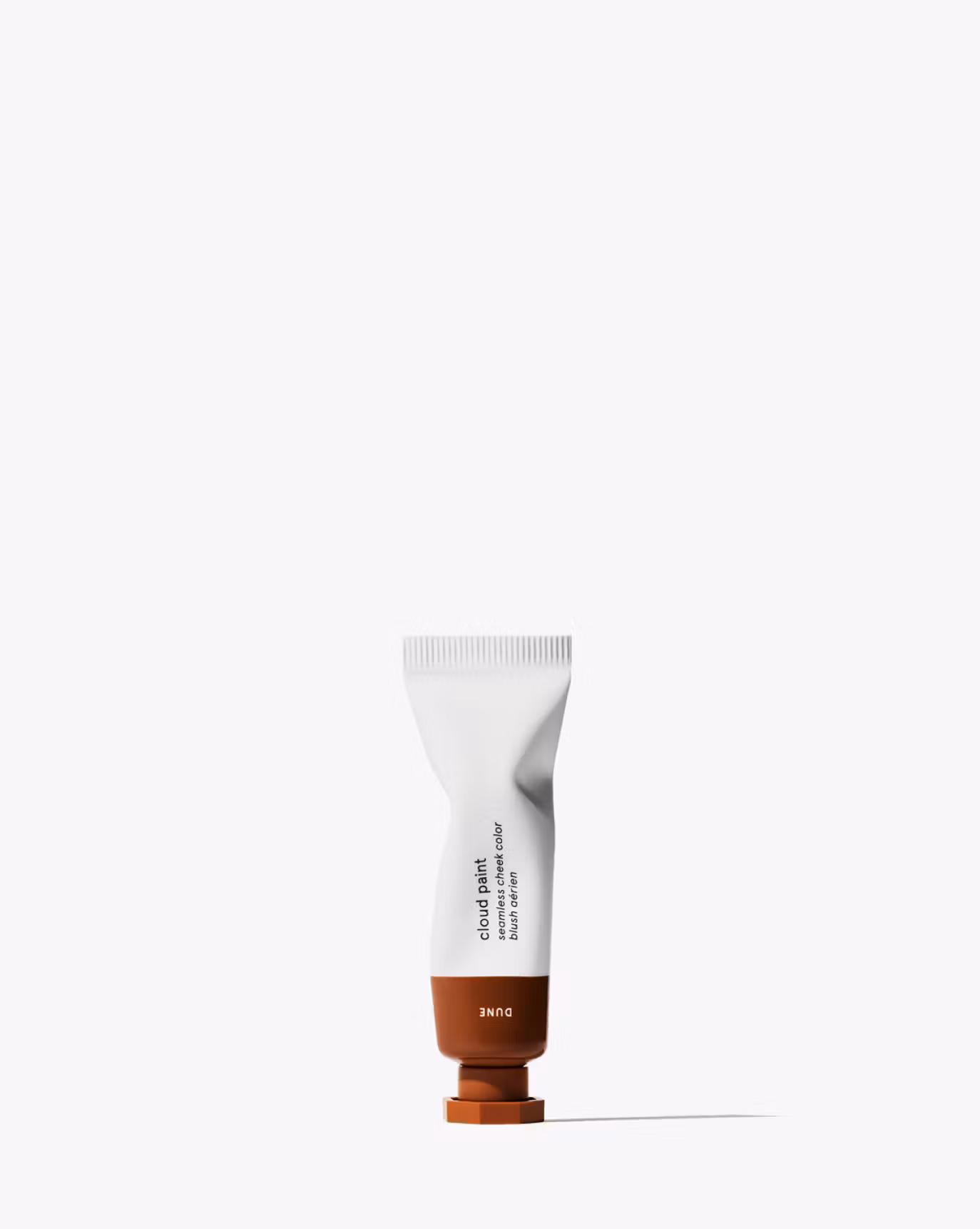 Cloud Paint Bronzer in a white tube.