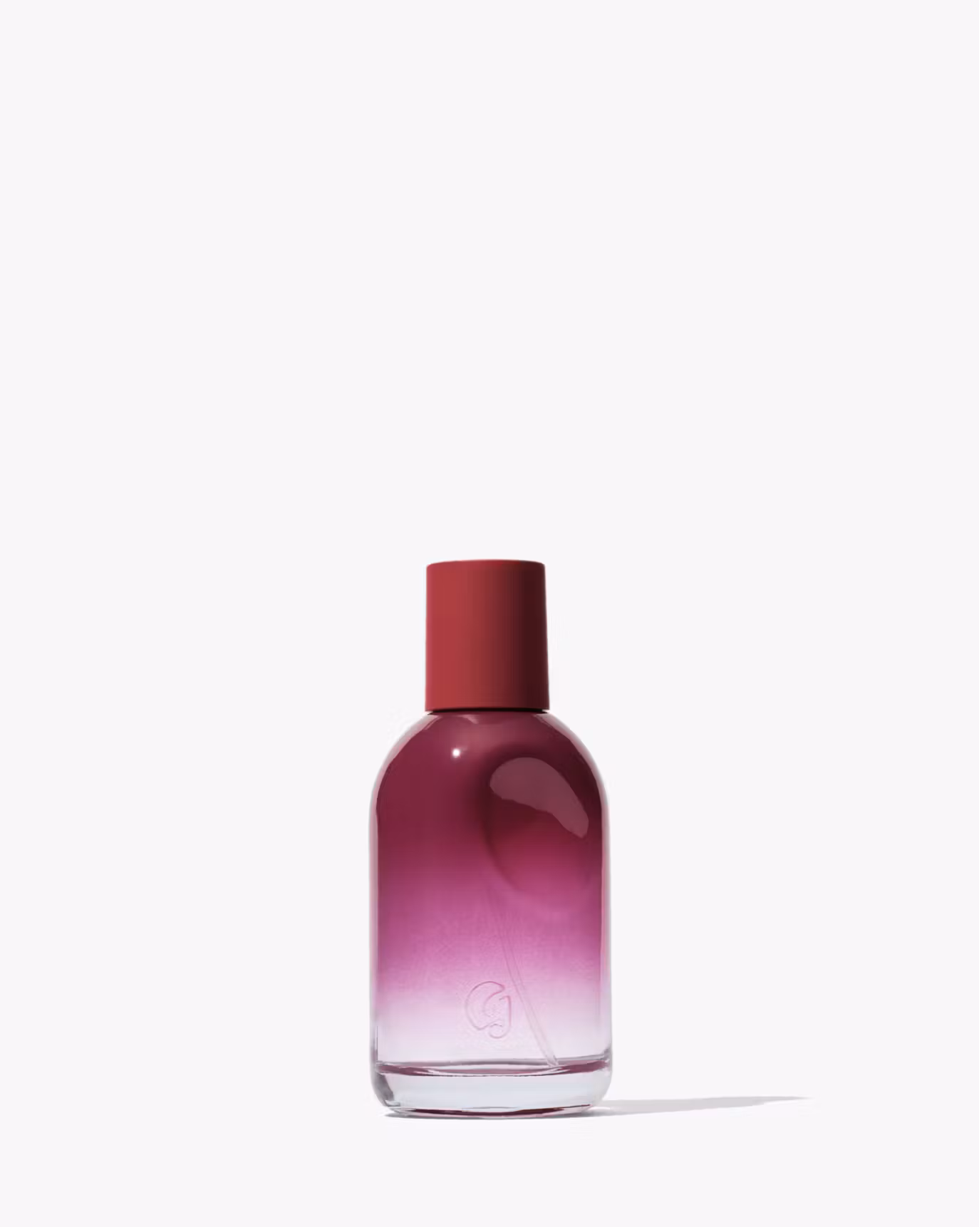 Glossier You Rêve in a plum bottle.