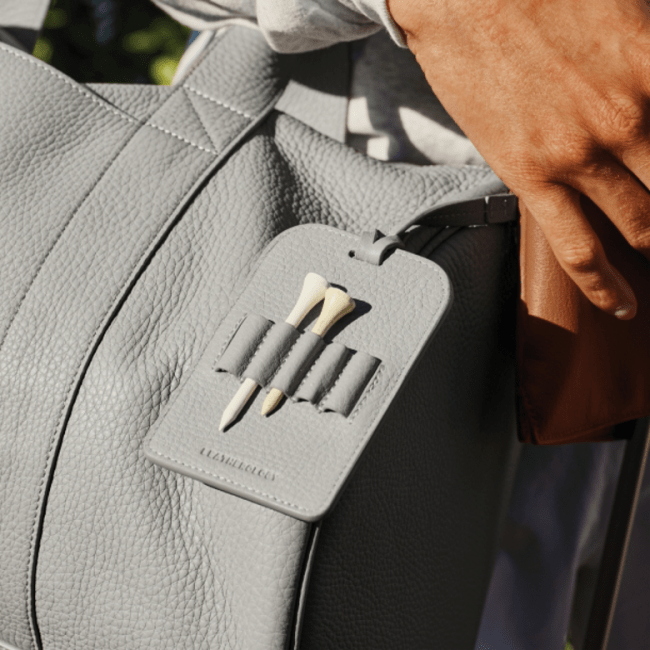 Leatherology Golf Bag Tee Holder in light grey attached to a matching golf bag.