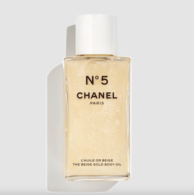 No 5 Beige Gold Body Oil in a clear bottle.
