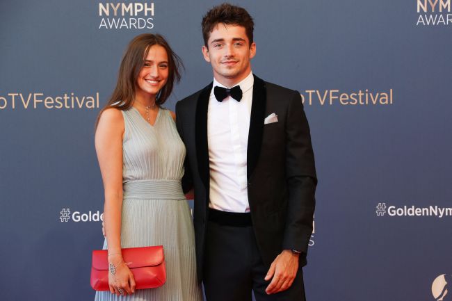 Ferrari's Monegasque driver Charles Leclerc and his partner Charlotte Sine pose during the closing ceremony of the 60th Monte-Carlo Television Festival in Monaco, on June 22, 2021.