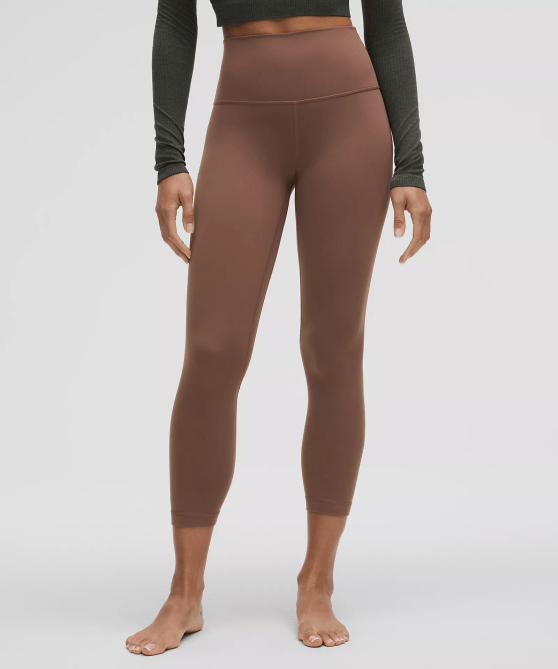 A model wearing the Lululemon Align High-Rise Crop 23" in brown