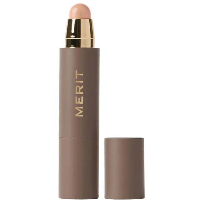 Merit The Minimalist Foundation and Concealer Stick in a brown stick.