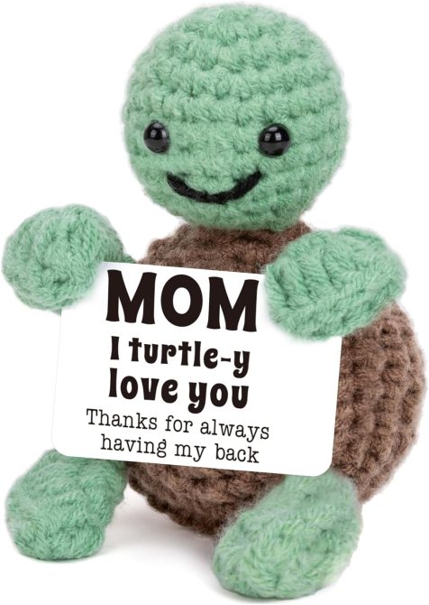 A crochet turtle holding a sign that reads 'Mom I turtle-y love you'