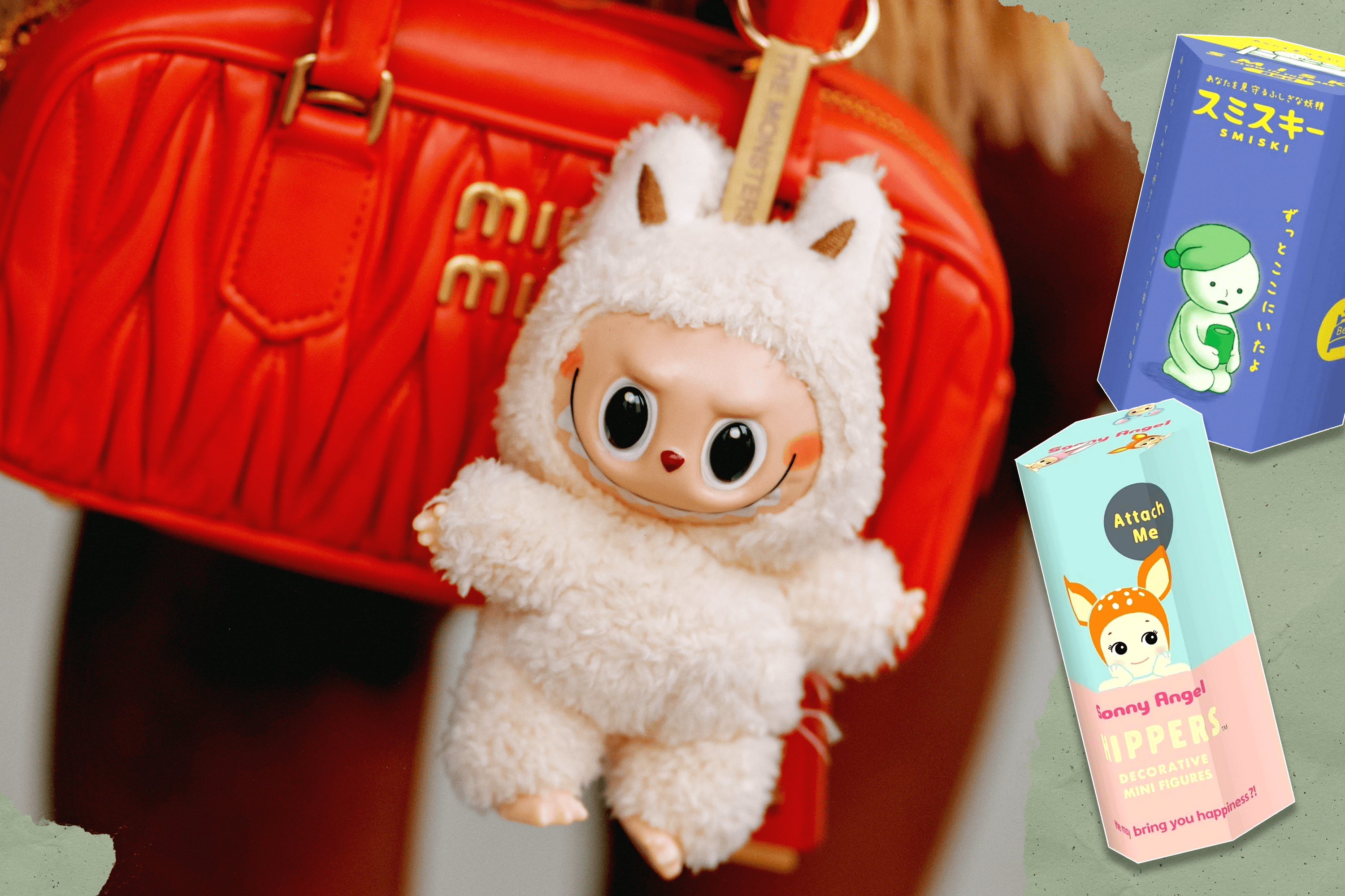 An image of a cream-colored Labubu attached to a bright orange Miu Miu purse with two blind boxes to the right (Smiski and Sonny Angel)
