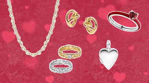 A red background with hearts featuring a heart-shaped gold chain necklace, red enamel heart ring, heart-shaped hoop earrings, a silver heart locket, and a set of two chain bands with a heart stone center.