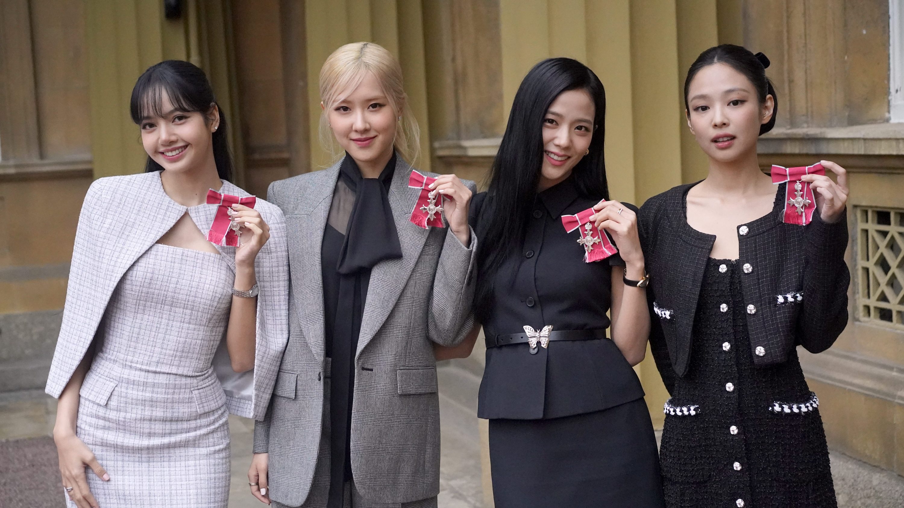 LONDON, ENGLAND - NOVEMBER 22: (left to right) Lisa (Lalisa Manoban), Rose (Roseanne Park), Jisoo Kim and Jennie Kim, from the K-Pop band Blackpink pose with their Honorary MBEs (Members of the Order of the British Empire), awarded to them in recognition of the band's role as COP26 advocates for the COP26 Summit in Glasgow 2021 on November 22, 2023 in London, England. King Charles III conducted the special Investiture ceremony in the presence of the President of South Korea, Yoon Suk Yeol, and his wife, Kim Keon Hee. (Photo by Victoria Jones - Pool/Getty Images)