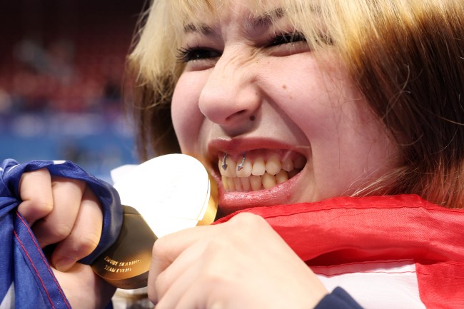 MILAN, ITALY - FEBRUARY 08: Gold medalist Alyssa Liu of Team United States celebrates with her medal following the Medal Ceremony for the Team Event after the Men's Single Skating - Free Skating Team Event on day two of the Milano Cortina 2026 Winter Olympic games at Milano Ice Skating Arena on February 08, 2026 in Milan, Italy.