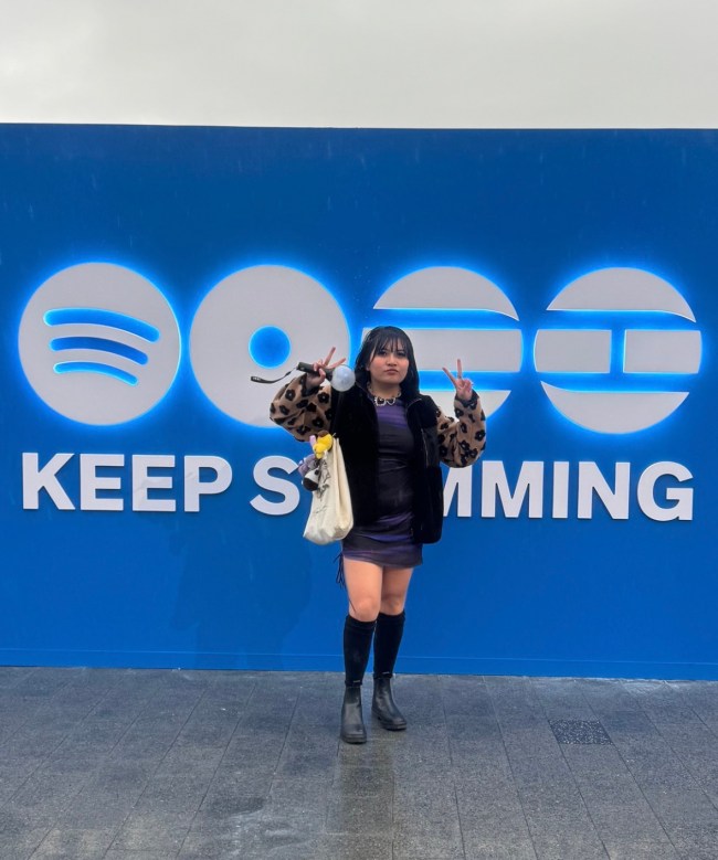 Lea Veloso standing in front of a Spotify x BTS Arirang Keep Swimming sign at the SWIMSIDE event in NYC in 2026.